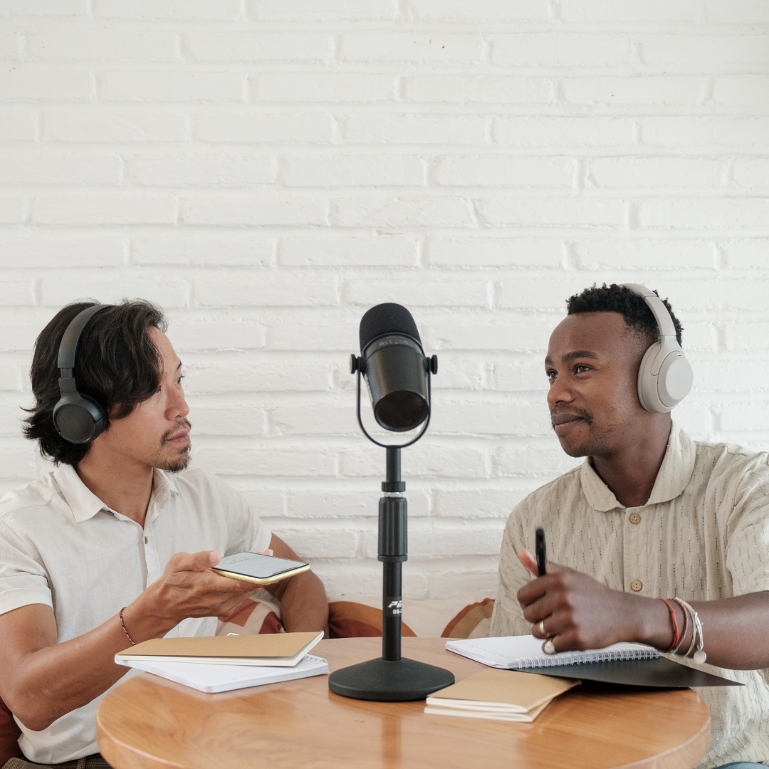 two men in discussion on a podcast