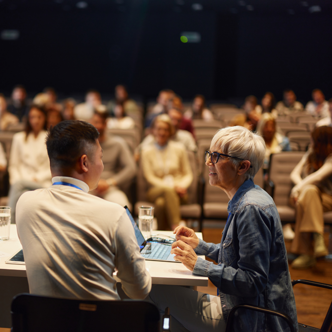 image of lots of people at an event some watching, some presenting