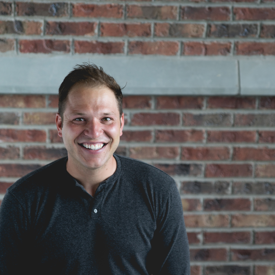 Head shot - man smiling at camera