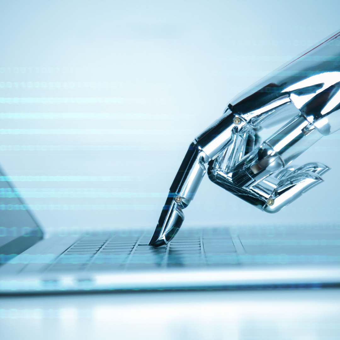 image of robot hand and keyboard