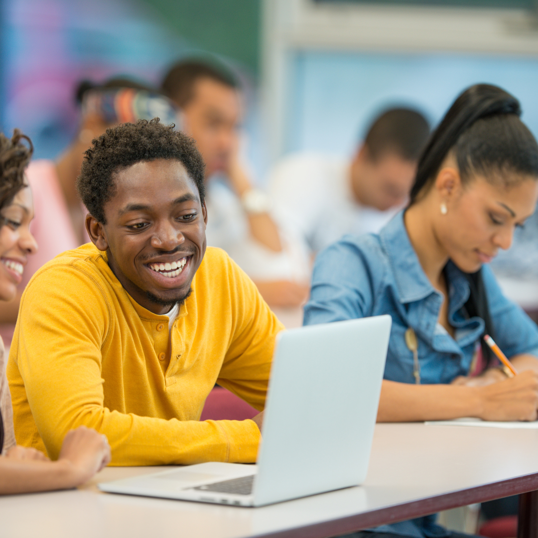 image of students on laptop