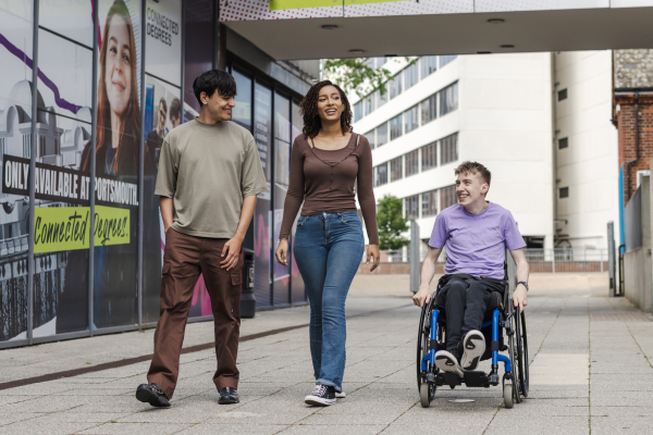 Image of 3 students from different backgrounds and physical abilities