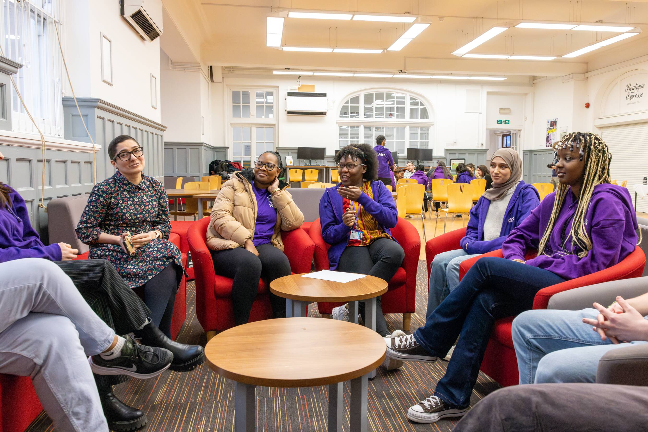 Image of students discussing for &quot;Beyond Borders - Panel Discussion&quot;
