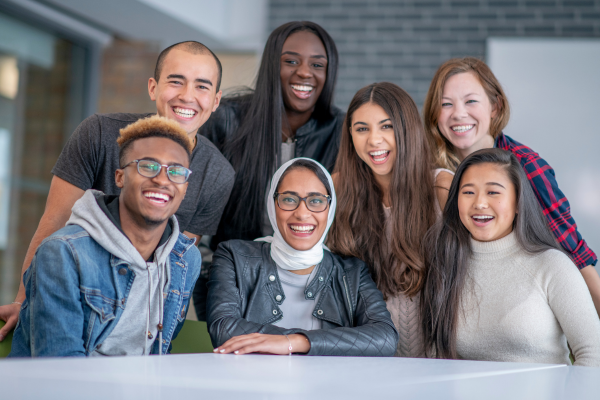 Diverse group of students smiling at camera