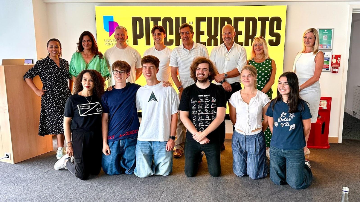 Image shows a group of people involved with 'Pitch to the Experts' workshop.