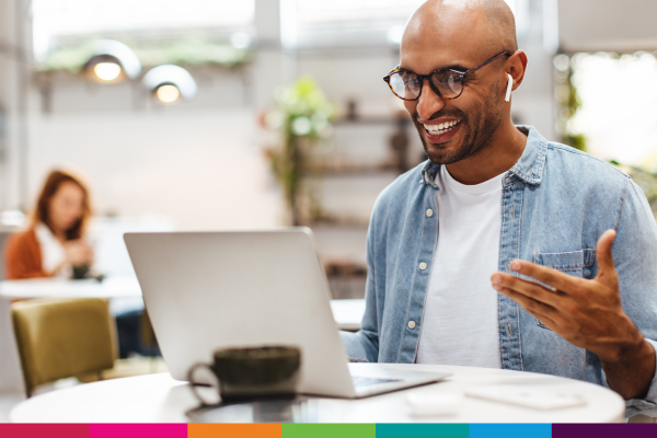 Image of man on laptop taking part in a webinar