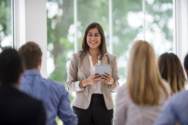 Image of woman presenting to a class of students
