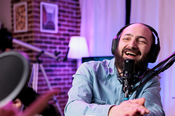 Image of man recording a podcast