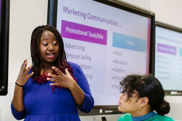 Image of academic presenting to class