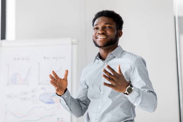 Image of man stood in front of people teaching