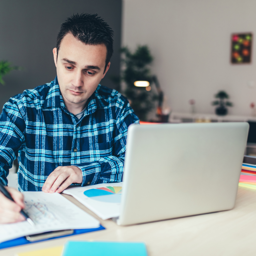 image of student sat at desk on laptop