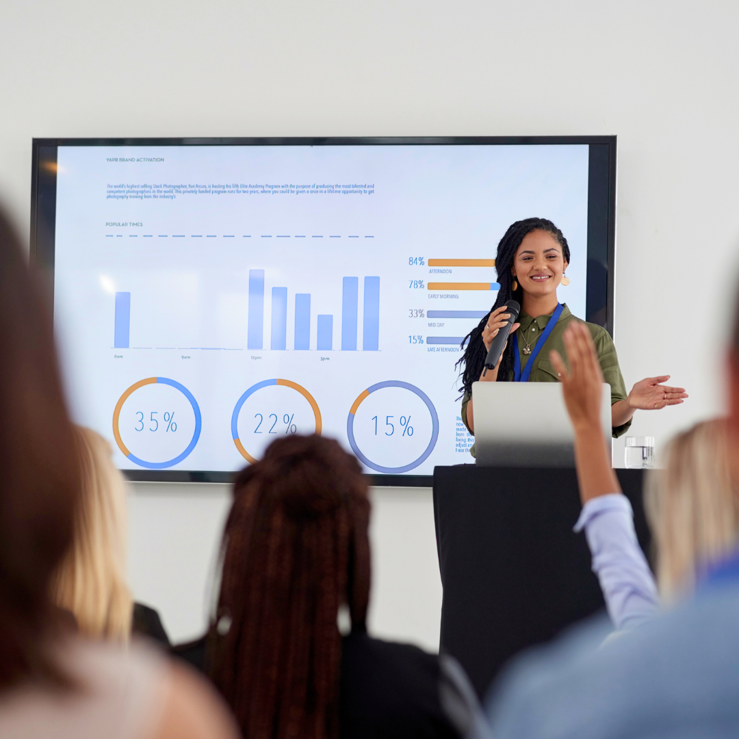 Image of woman presenting to class
