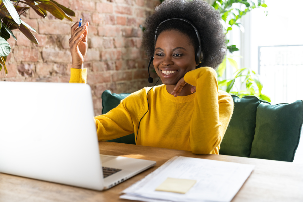 Image of woman on a laptop taking part in a webinar