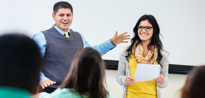 Image of two people presenting to a group