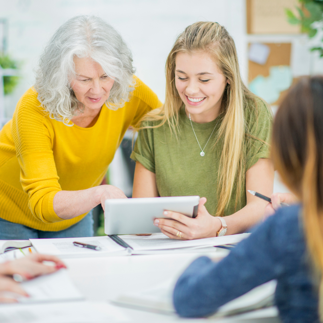 Image of people working together using a tablet