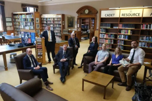 Image of people sat in library setting