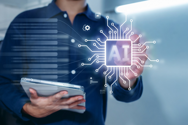 Image of person holding tablet with wording AI