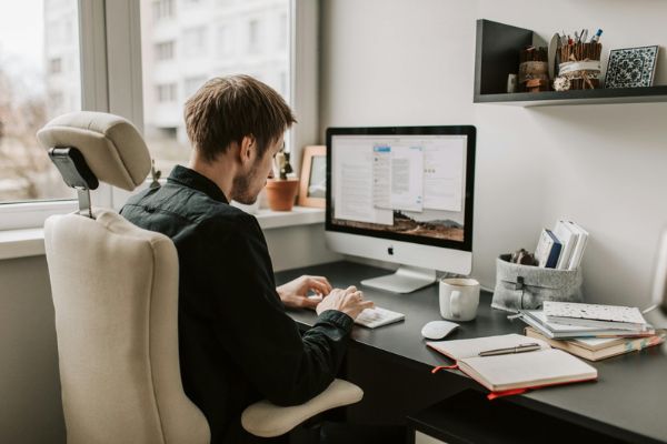 photo of student on desktop computer